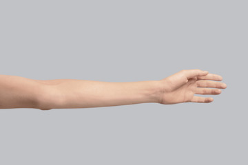 Wall Mural - young woman holding hand on grey background, closeup