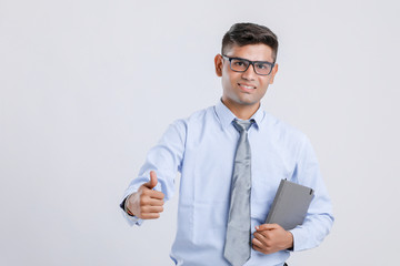 Wall Mural - Indian Man Showing Thumps Up And  Holding Book in hand 