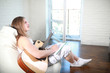© alexkich - Young man with long hair with a guitar