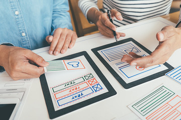 Creative Web Designer planning application and developing template layout, framework for mobile phone. User experience (UX) concept.