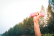© SUPERMAO - Elderly, lifting 1 kg of pink dumbbells, exercising in the park