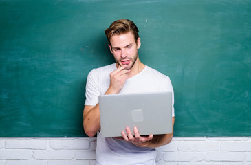 Wall Mural - Handsome man use modern technology. Digital technology. Apply online course for programmers. Programming web development. Student learn programming language. School teacher programming with laptop