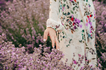 Wall Mural - girl feeling lavender flowers 