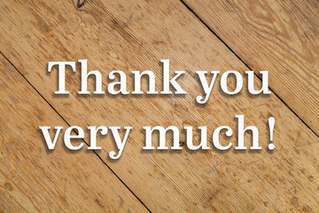Canvas Print - `Thank you very much` white text on a wooden home background. 