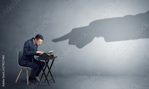 Cuadros en Lienzo Shadow hand pointing at a small afraid worker