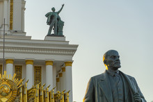 Soviet Communist Leader Vladimir Lenin Statue In Front Of Old Building At VDNH In Moscow