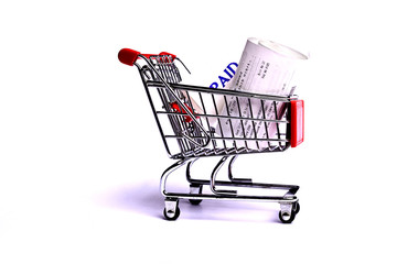 Wall Mural - Shopping Receipts in shopping trolley isolated on white background