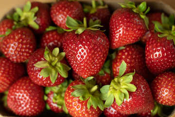 Fresh strawberries closeup. Open space, healthy food concept, plants, soil, organic natural products, natural food, vegetarian dishes, vegetables, raw, food festival