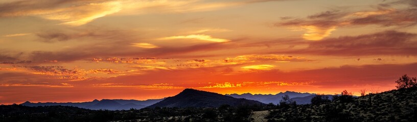 Wall Mural - A sunset over a distant mountain in the Sonoran Desert of Arizona panorama