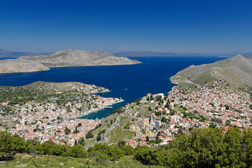 Wall Mural - Blick aud den Hafen von Symi, Griechenland (im Hintergrund Nimos und die türkische Küste)