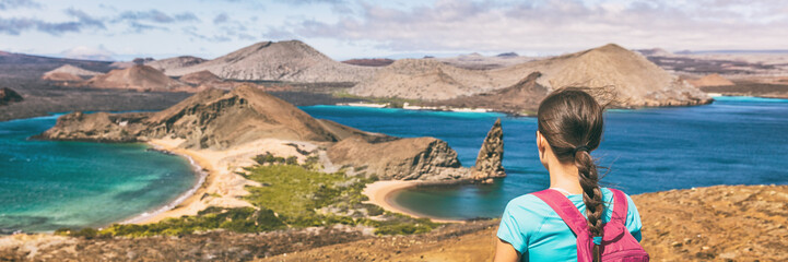 Wall Mural - Galapagos islands cruise vacation tourist woman panoramic banner. Bartolome or Bartholomew island view on hiking shore excursion travel tourism. Hiker traveling in Ecuador.