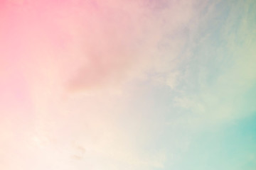 a soft cloud background with a pastel colored orange to blue gradient.