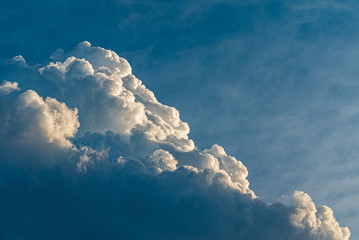 Wall Mural - blue sky with clouds and sun, sunset