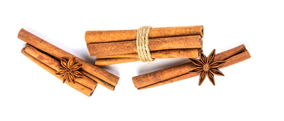 Wall Mural - Close up the brown cinnamon stick with star anise spice isolated on white background , overhead and top view