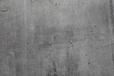 Fototapeta Desenie - Grey textured concrete wall exterior