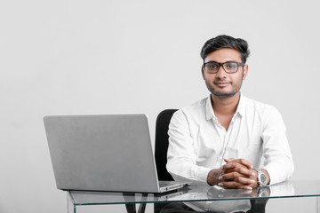 young indian man working at office