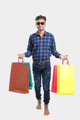 Wall Mural - young indian man with shopping bags, Indian festival