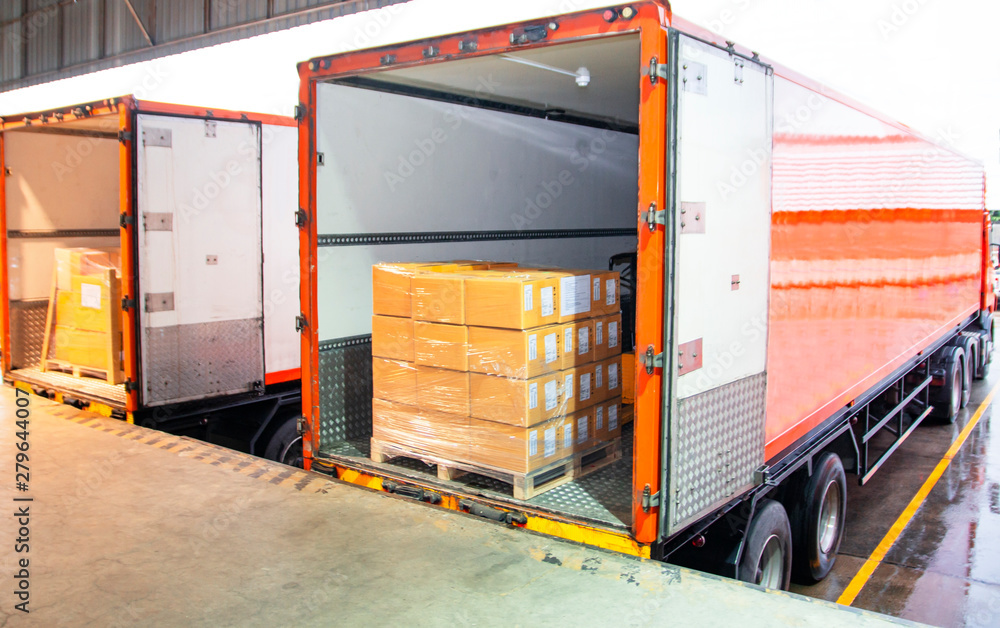 Cargo freight, Shipment, Delivery service. Logistics and transportation. Warehouse dock load pallet goods into shipping container truck. Stacked package boxes on pallet inside a truck. - obrazy, fototapety, plakaty 