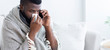 © Prostock-studio - Sick black man calling on phone. to doctor