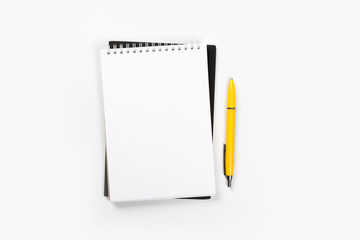 school notebook on a white background, spiral notepad on a table.