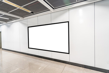 Blank advertising display in subway station underpass public area