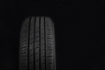 Car tires on black background. Shop Tires and wheels.