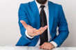 © Zofia - Man holds empty paper with copy space in front of him. White space for advertising message.