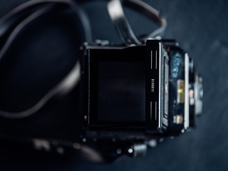 Top down view of old medium format film camera viewfinder with shadows and side light