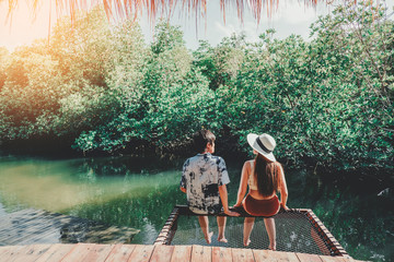 Couple relaxing in mangrove forest Lagoon vacation time