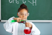 Little African-American Scientist In Laboratory