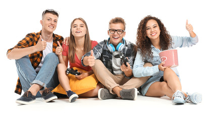 Wall Mural - Teenagers playing video game on white background