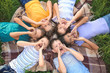 © Pixel-Shot - Group of children lying on plaid in park