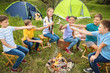 © Pixel-Shot - Children roasting marshmallow on fire at summer camp
