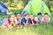 © Pixel-Shot - Group of children resting at summer camp