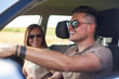 © gpointstudio - Young couple traveling by car in summertime