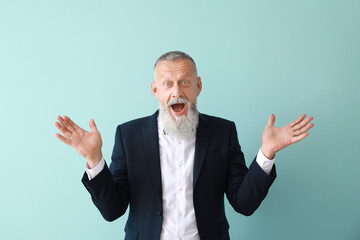 Poster - Happy mature man on color background