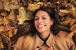 © Jelena - Smiling girl on autumn leaves