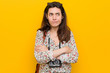 © Asier - Young brunette traveler woman confused, feels doubtful and unsure.