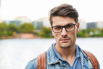 Sticker - Handsome young man dressed casually spending time outdoors