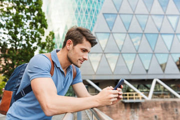 Poster - Handsome young man dressed casually spending time outdoors