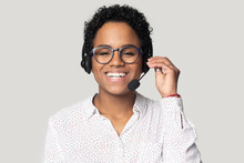 Portrait Of Smiling Biracial Female Call Center Agent In Headset