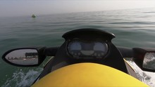 Close Up Of The Handle Bars And Mirror Of Jet Ski. Detail Of Yellow Jet Ski Driving On The Water. Holiday Water Sports.