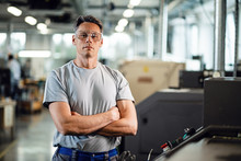 Portrait Of Confident CNC Machine Operator In A Factory.