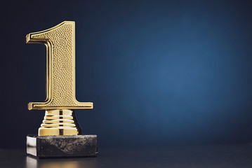 Wall Mural - champion or winner gold trophy over blue