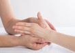 © onlyyouqj - Physiotherapist doing hand massage in medical office