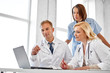 © Syda Productions - healthcare, medicine and technology concept - group of doctors with laptop computer at hospital