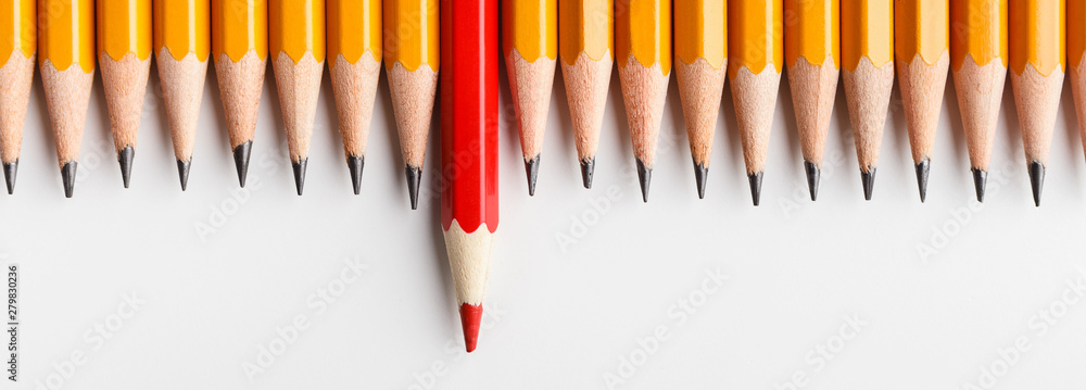 Red pencil protruding out of row with classic ones - obrazy, fototapety, plakaty 