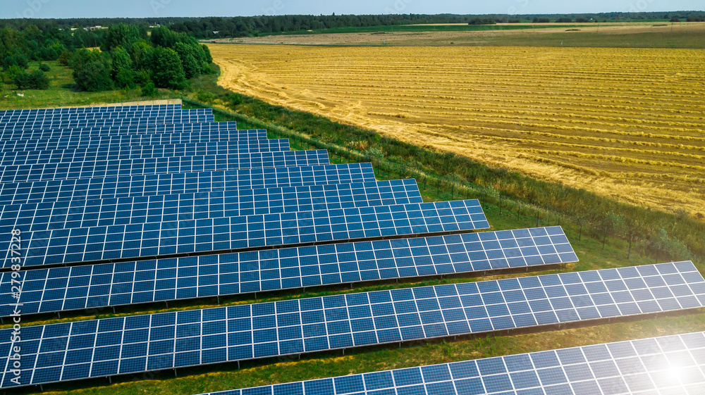 Aerial shot top view of solar panel photovoltaic farm - obrazy, fototapety, plakaty 