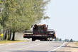 © dzmitry_2014 - modern combine harvester moves by road
