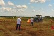 © evgenij84 - Kostivtsi, Ukraine-July 13, 2019: The two judges watch as the participant passes the track. Figure piloting competition at the field. Berry festival Brusviana